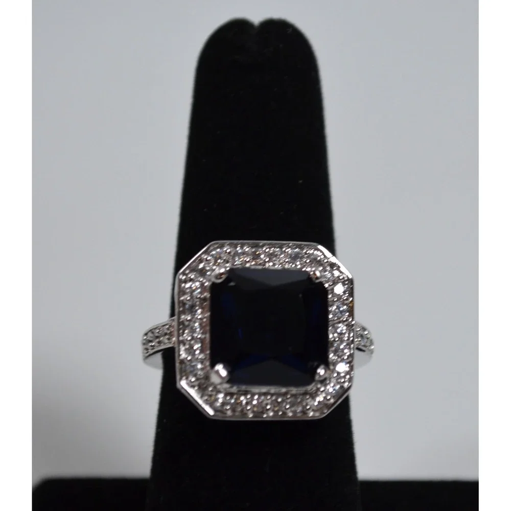 Silver Tone Ring Sz 6.75 w/ Large Blue Setting Sounded By Tiny Clear Rhinestones